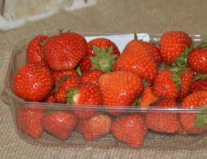 red strawberries in clear glass container thumbnail