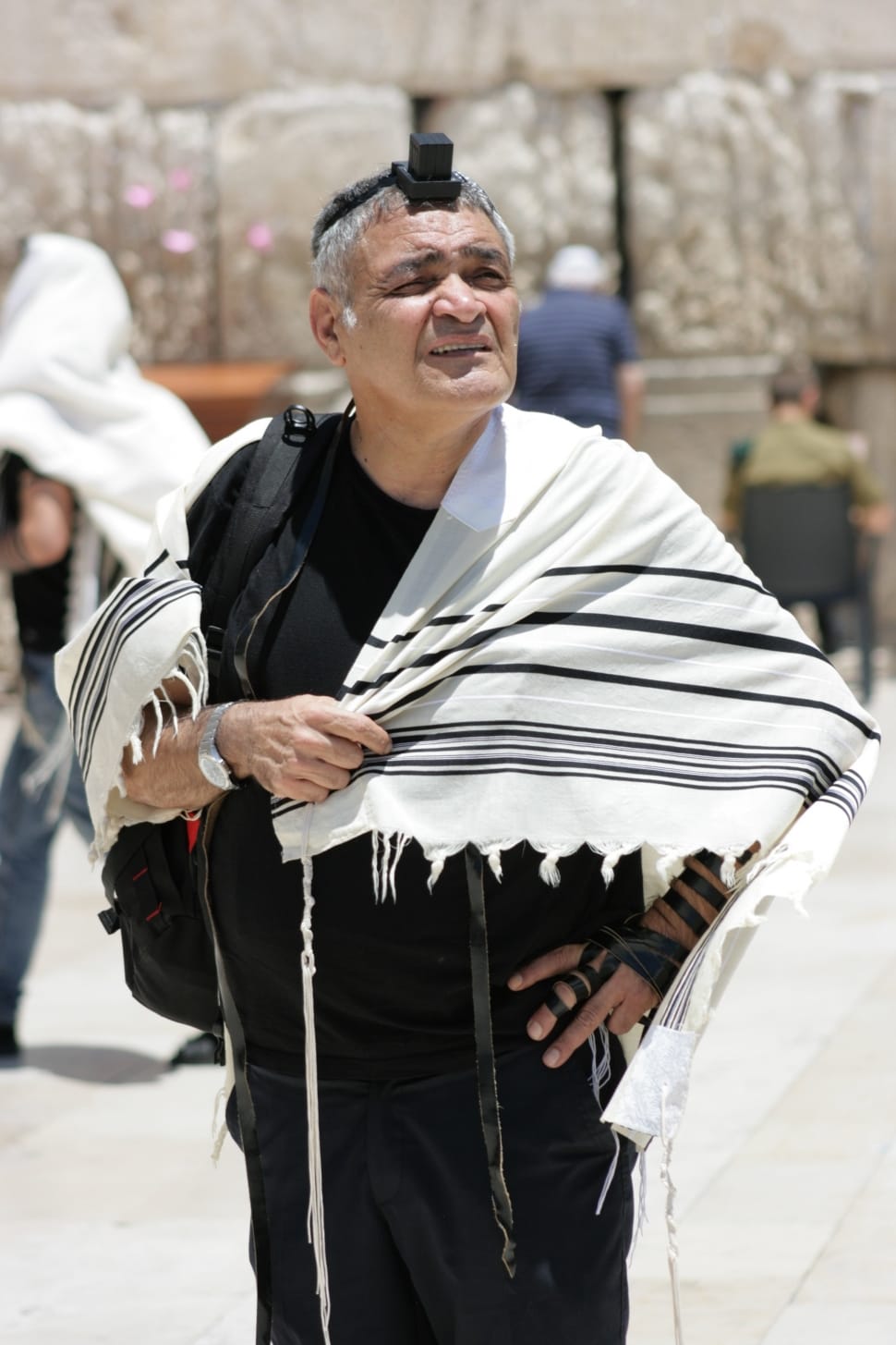 man in white scarf and black suit preview