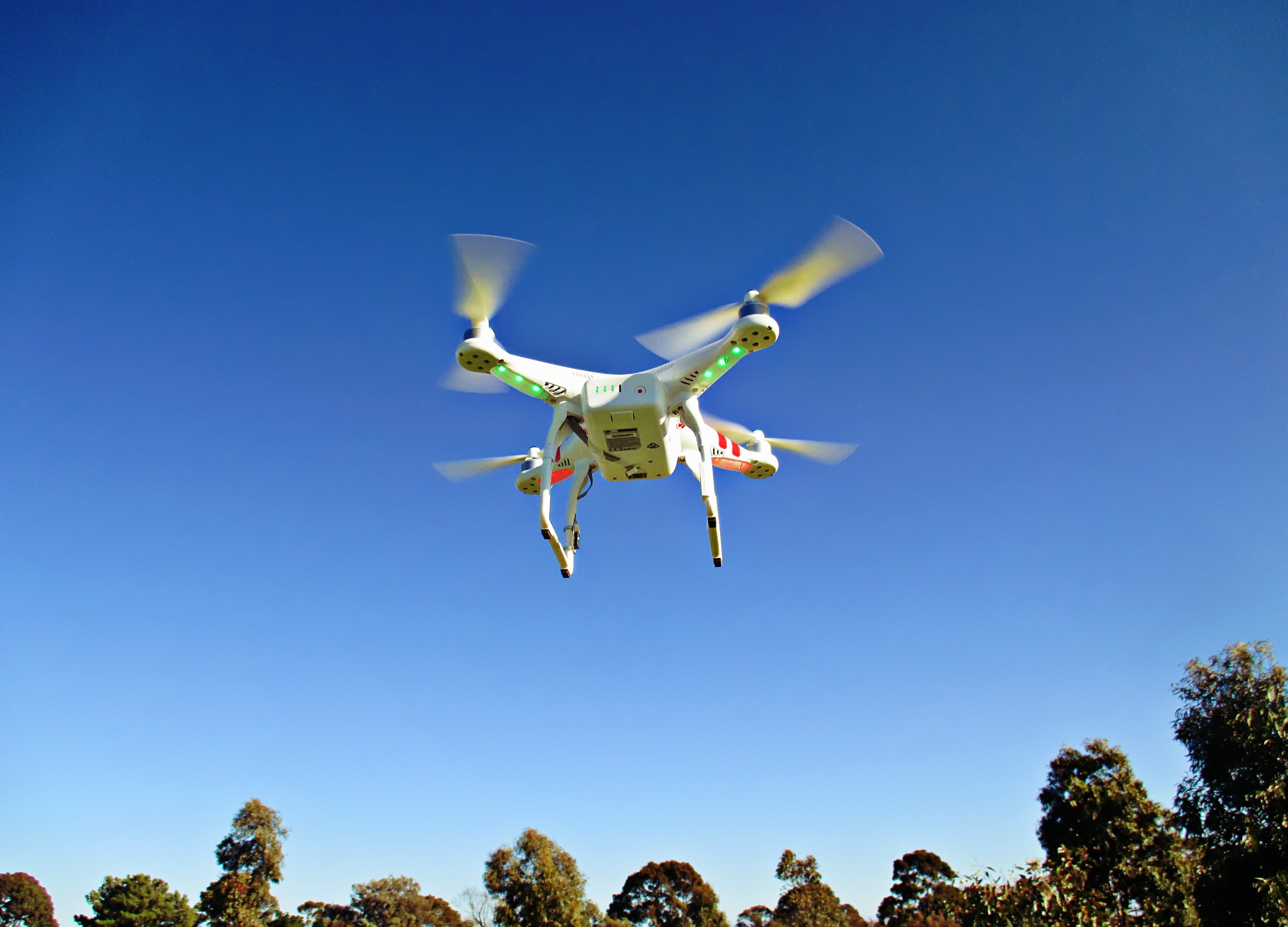 white quad copter drone