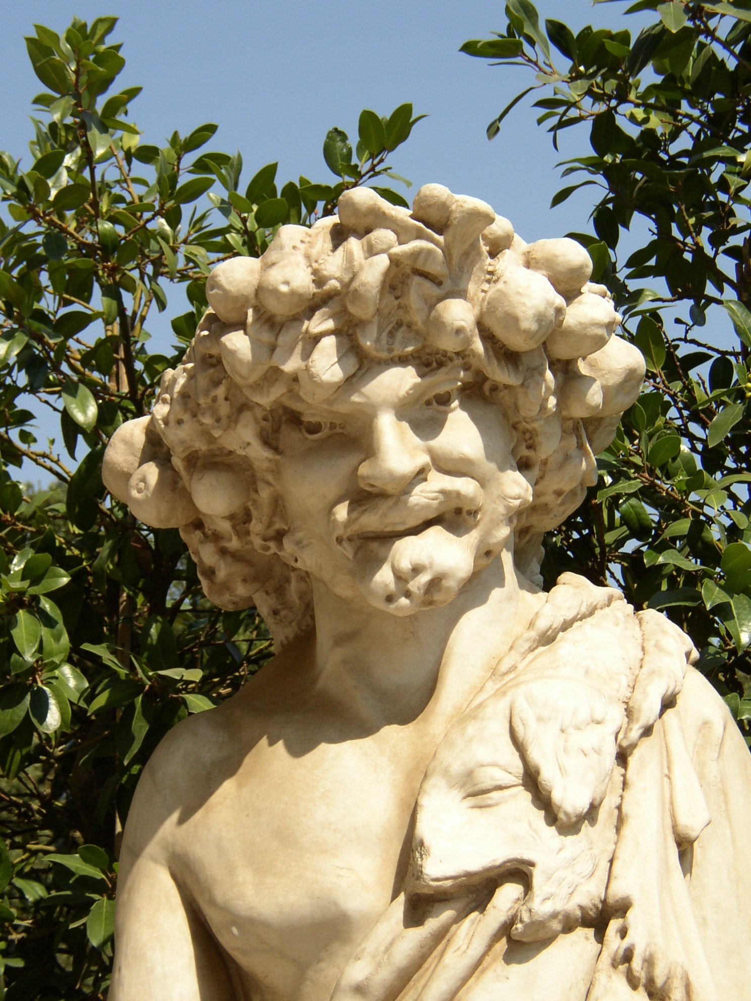 man statue beside green leaf plant
