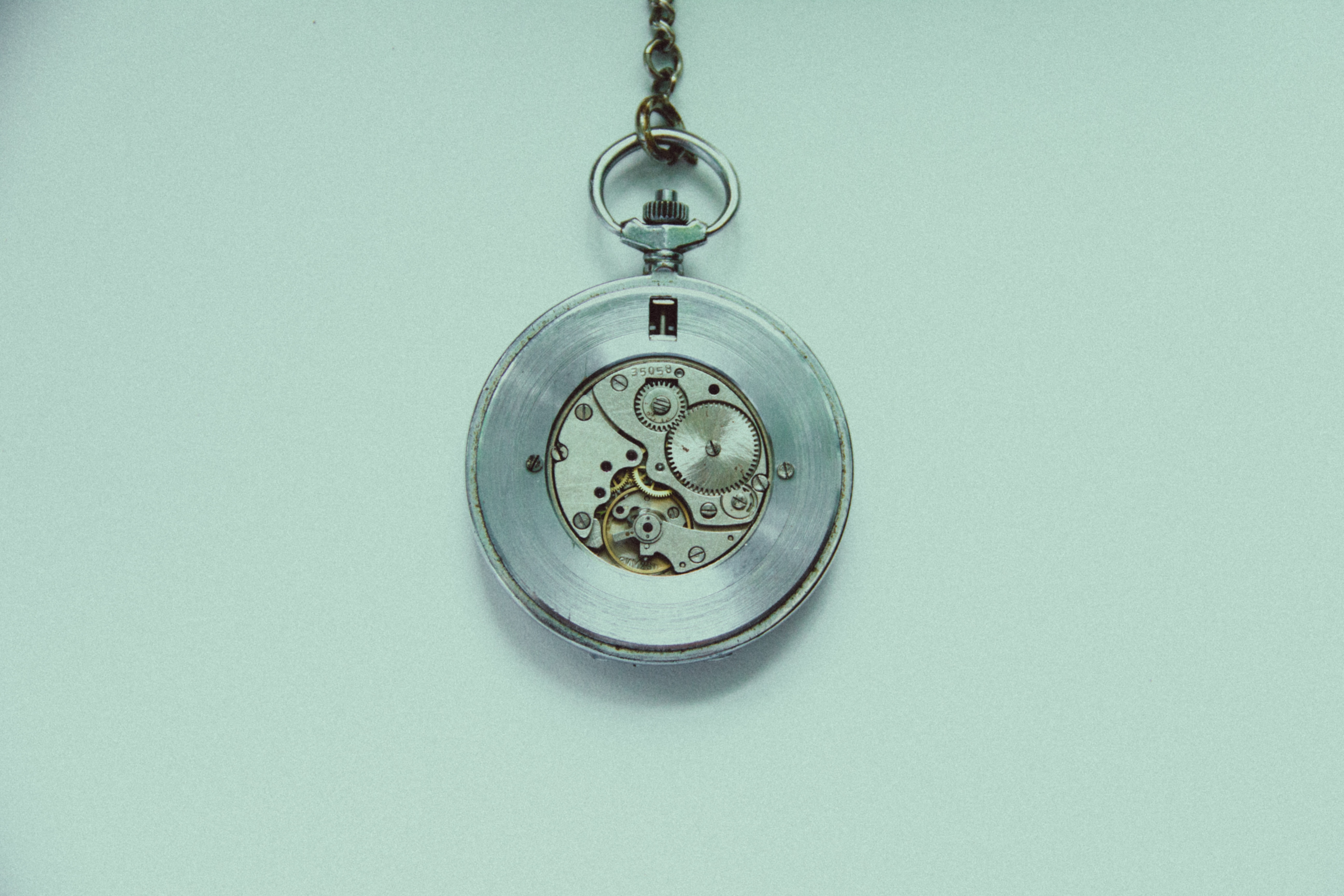round stainless skeletal pocket watch