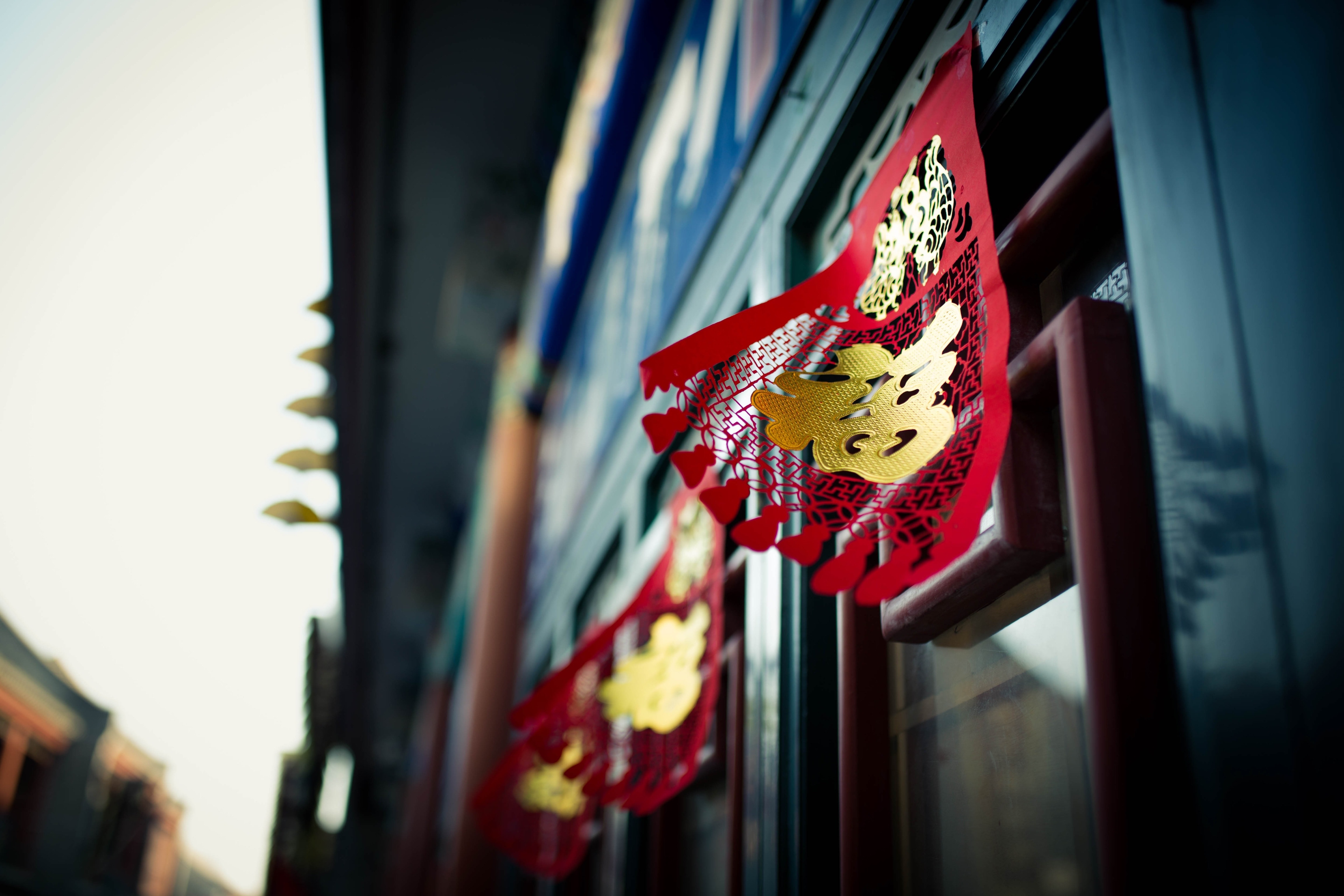 red and brown kanji labeled ornament