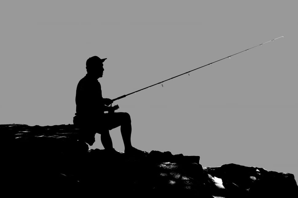 silhouette photo of man fishing free image