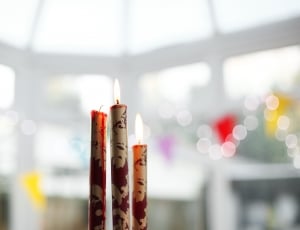 3 brown candle stick candles thumbnail