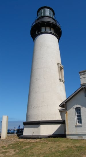 white and black concrete lighthouse thumbnail