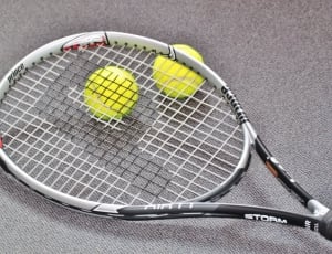 black and white storm tennis racket thumbnail