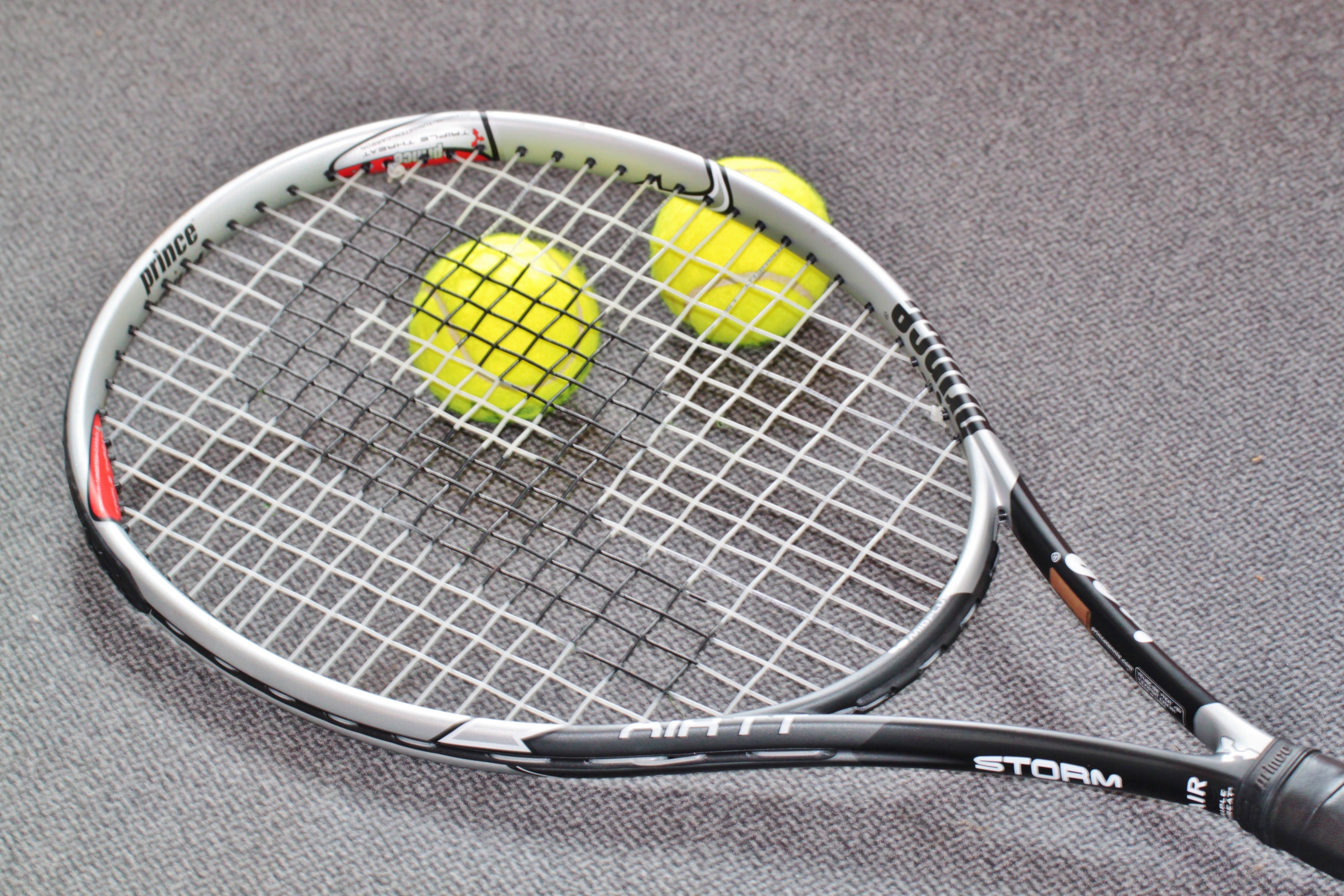 black and white storm tennis racket