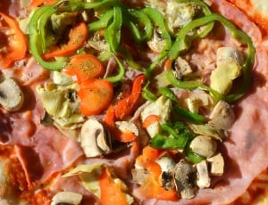 assorted slice vegetable in beige round pizza thumbnail
