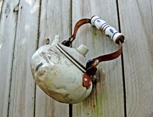 white and red metal kettle thumbnail