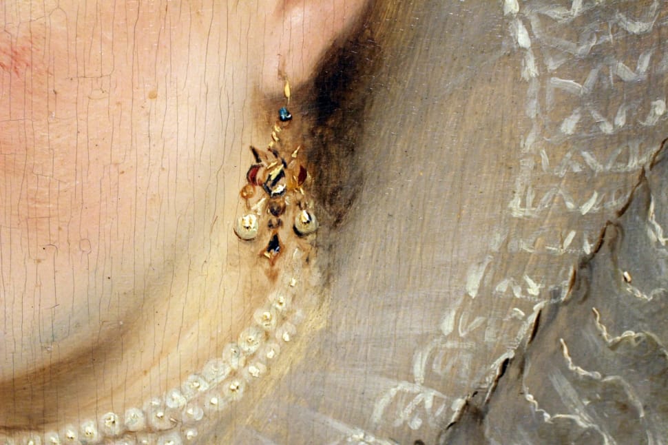 woman wearing gold drop hook earrings preview