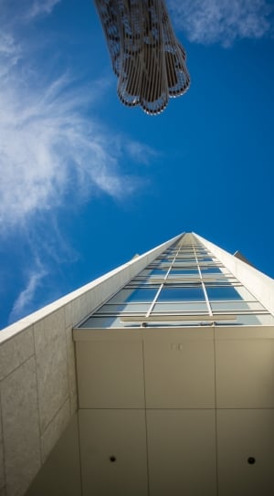 low angle photography of concrete high raised building during daytime thumbnail