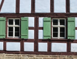 brown and green wooden window frames thumbnail