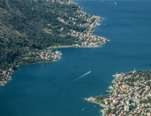 areal photo of city near sea thumbnail