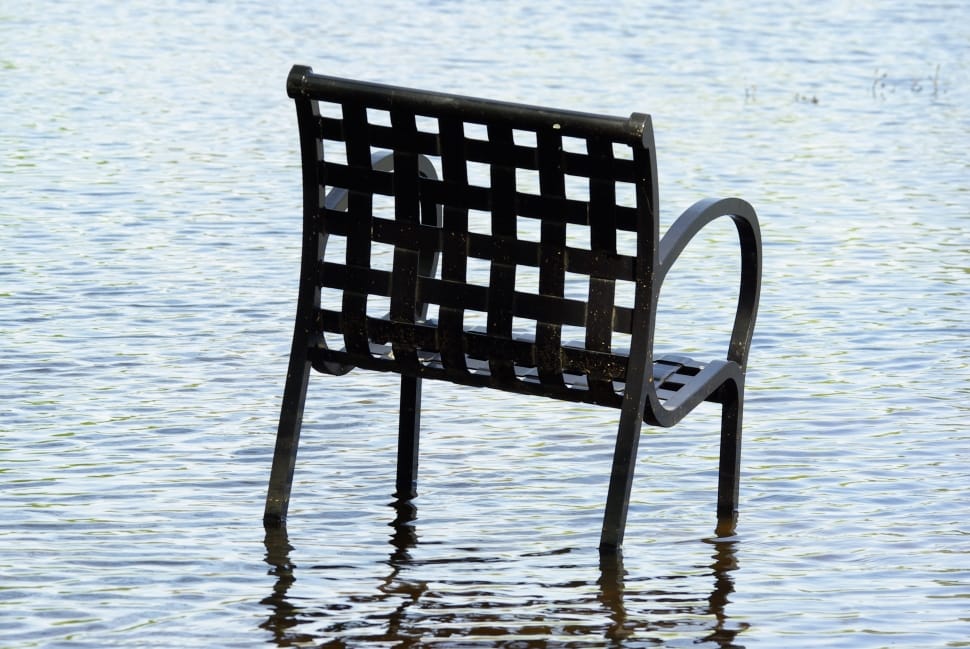 black steel armchair in body of water preview