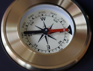 silver and white round analog compass thumbnail
