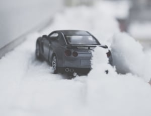 silver sports car in snow field thumbnail