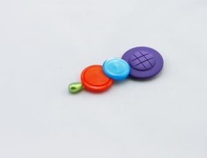 Buttons, Buttons On A Hat Pin, Colorful, studio shot, white background thumbnail