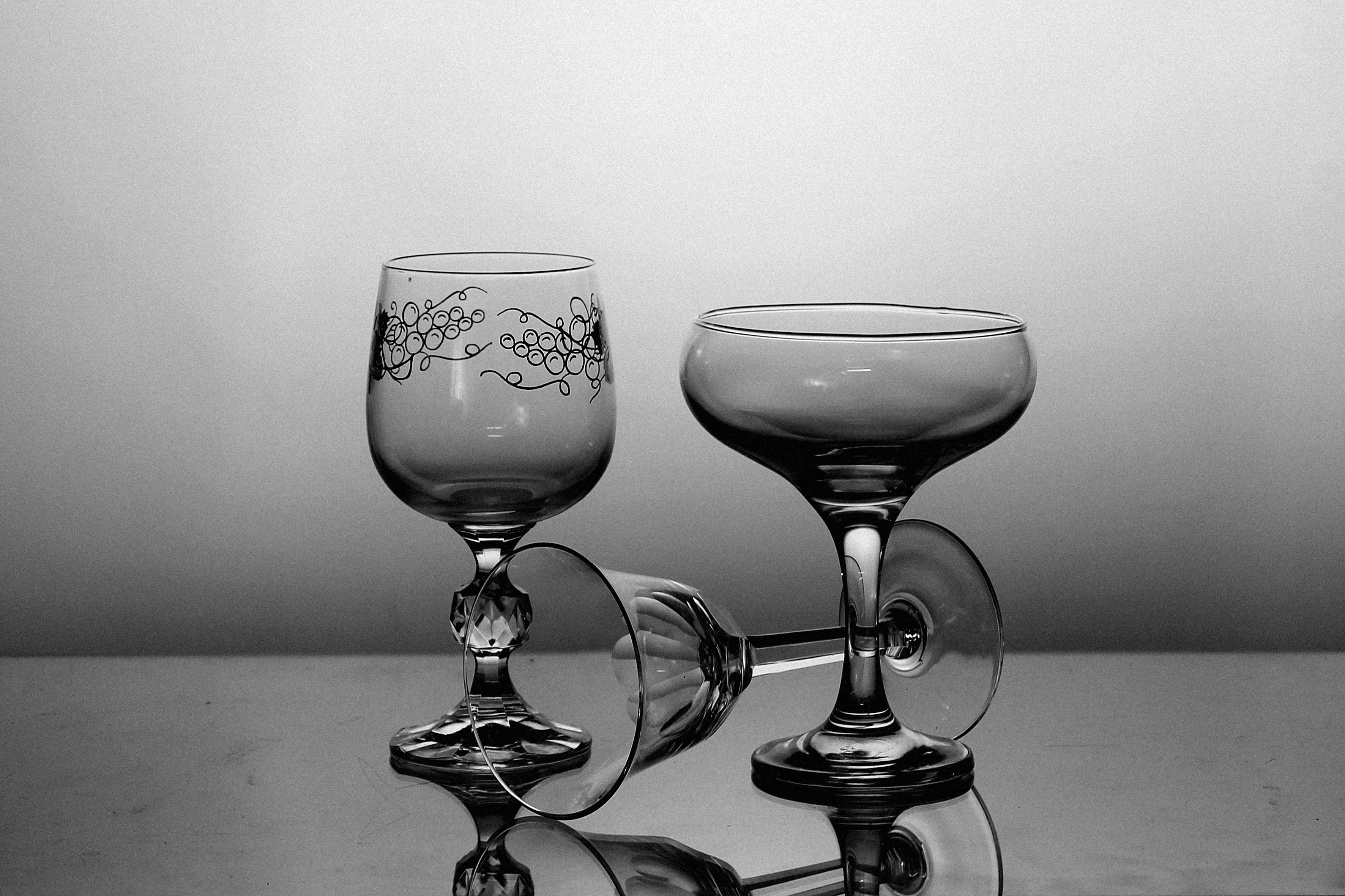 3 black translucent wine glasses