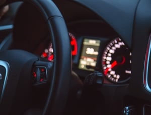 black audio steering wheel with instrumental cluster panel thumbnail