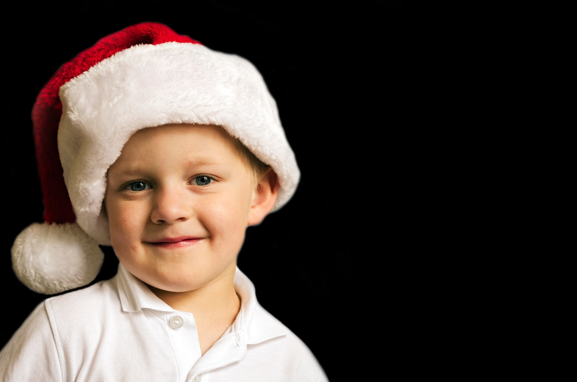 boy's white and red santa hat