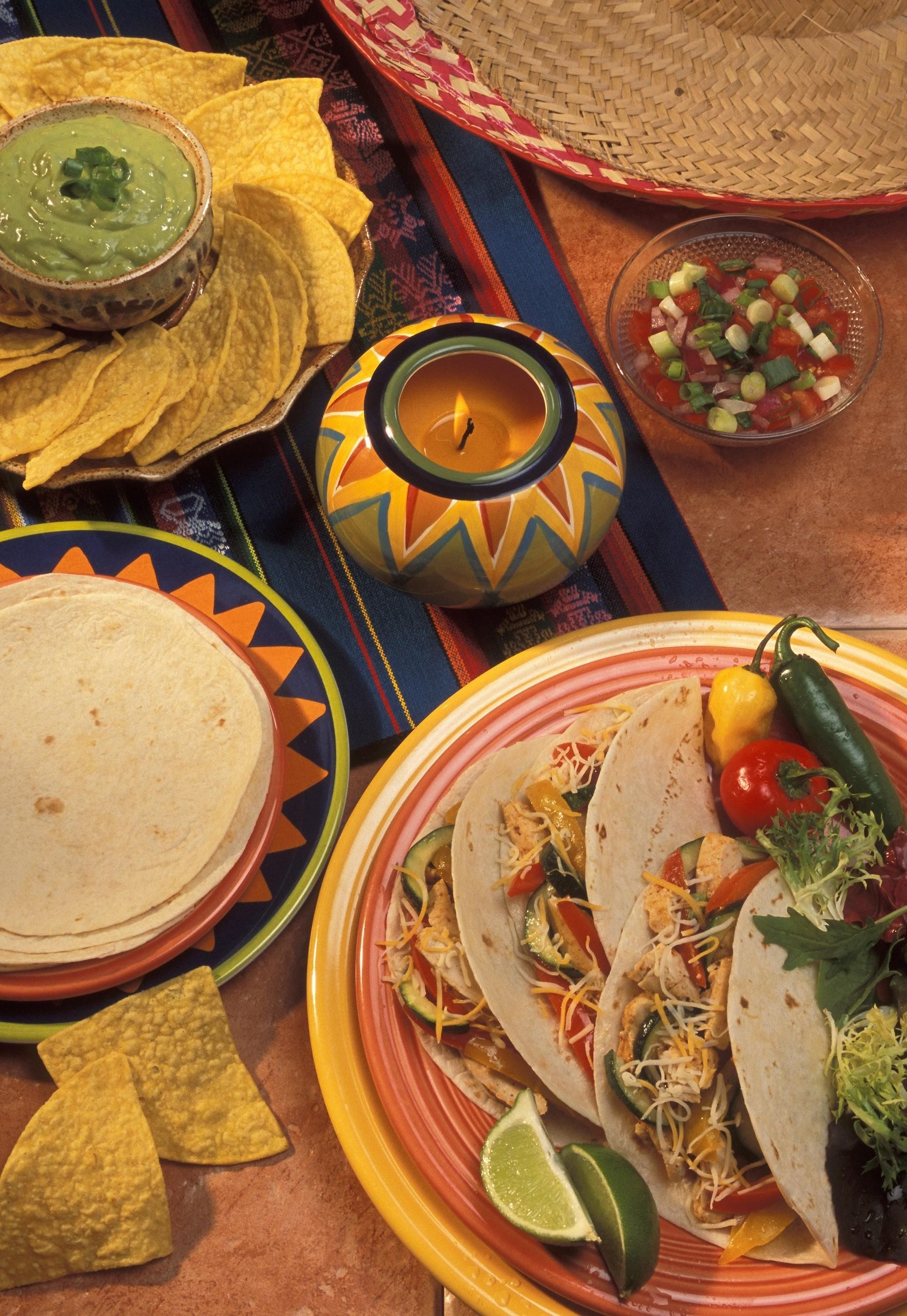 tacos on yellow and red ceramic round plaet