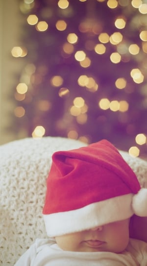 baby wearing santa clause hat thumbnail
