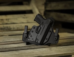 black semiautomatic hand gun with holster thumbnail