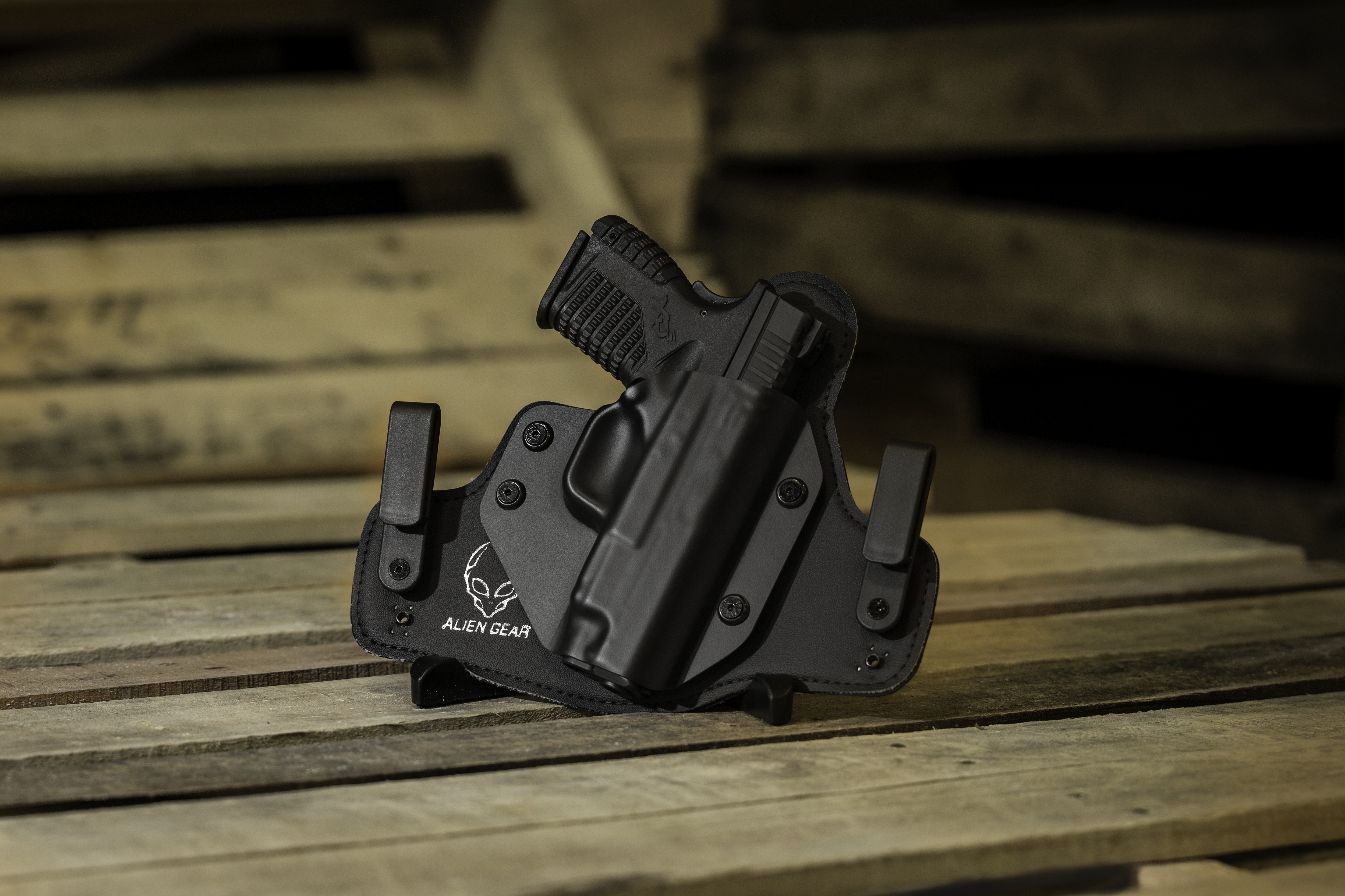 black semiautomatic hand gun with holster