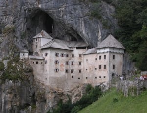 gray wall castle near the edge of cave thumbnail