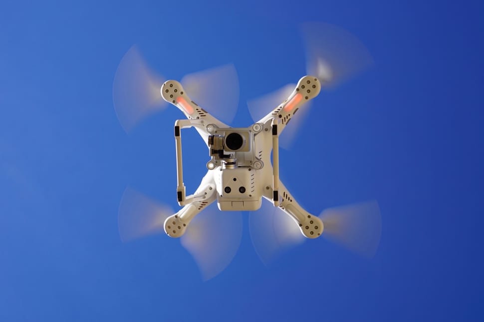 white quadcopter drone preview