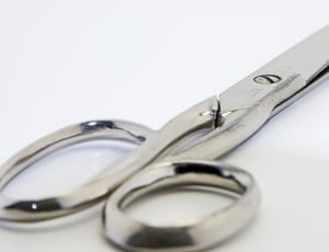 stainless steel Scissor on white surface thumbnail