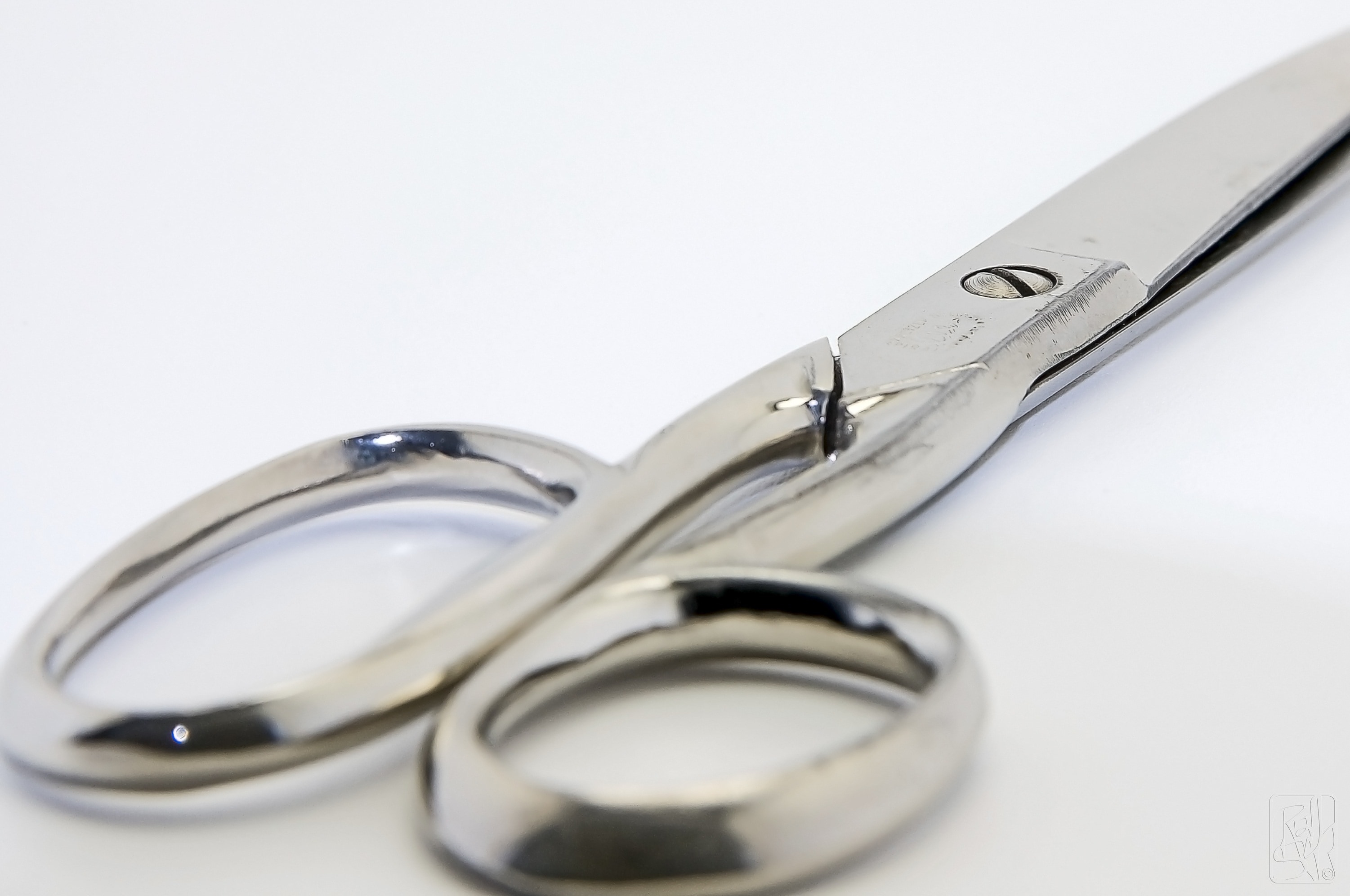 stainless steel Scissor on white surface