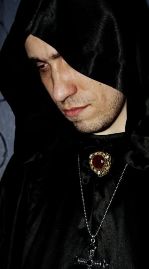 Man wearing black hooded jacket thumbnail