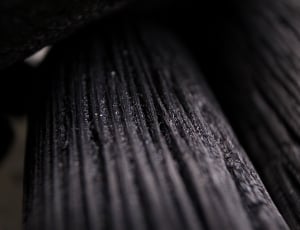 close up photo of black wood surface thumbnail