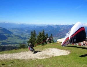 white red and black paragliding thumbnail