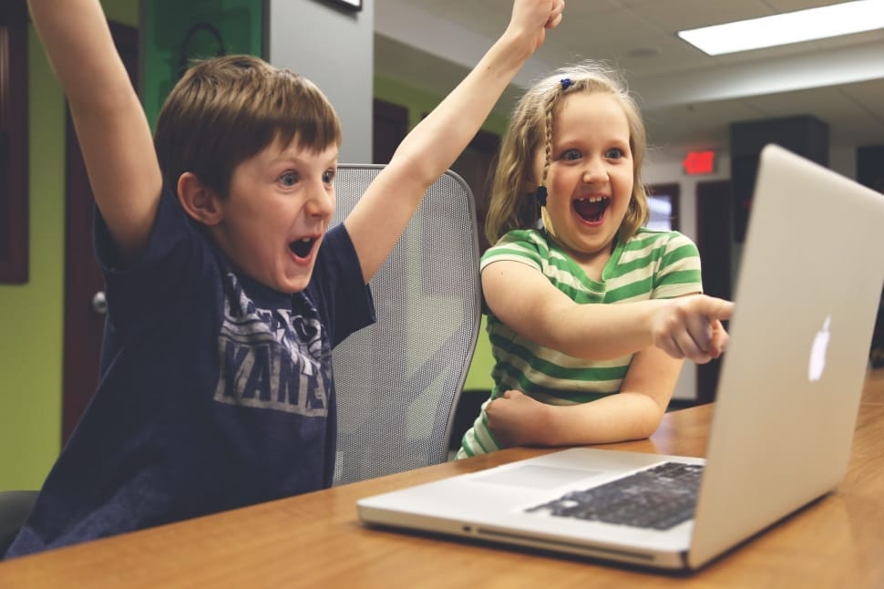 kids pointing to computer