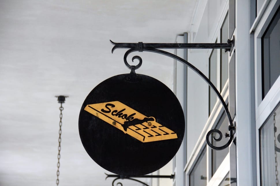 black and beige metal schok signage preview