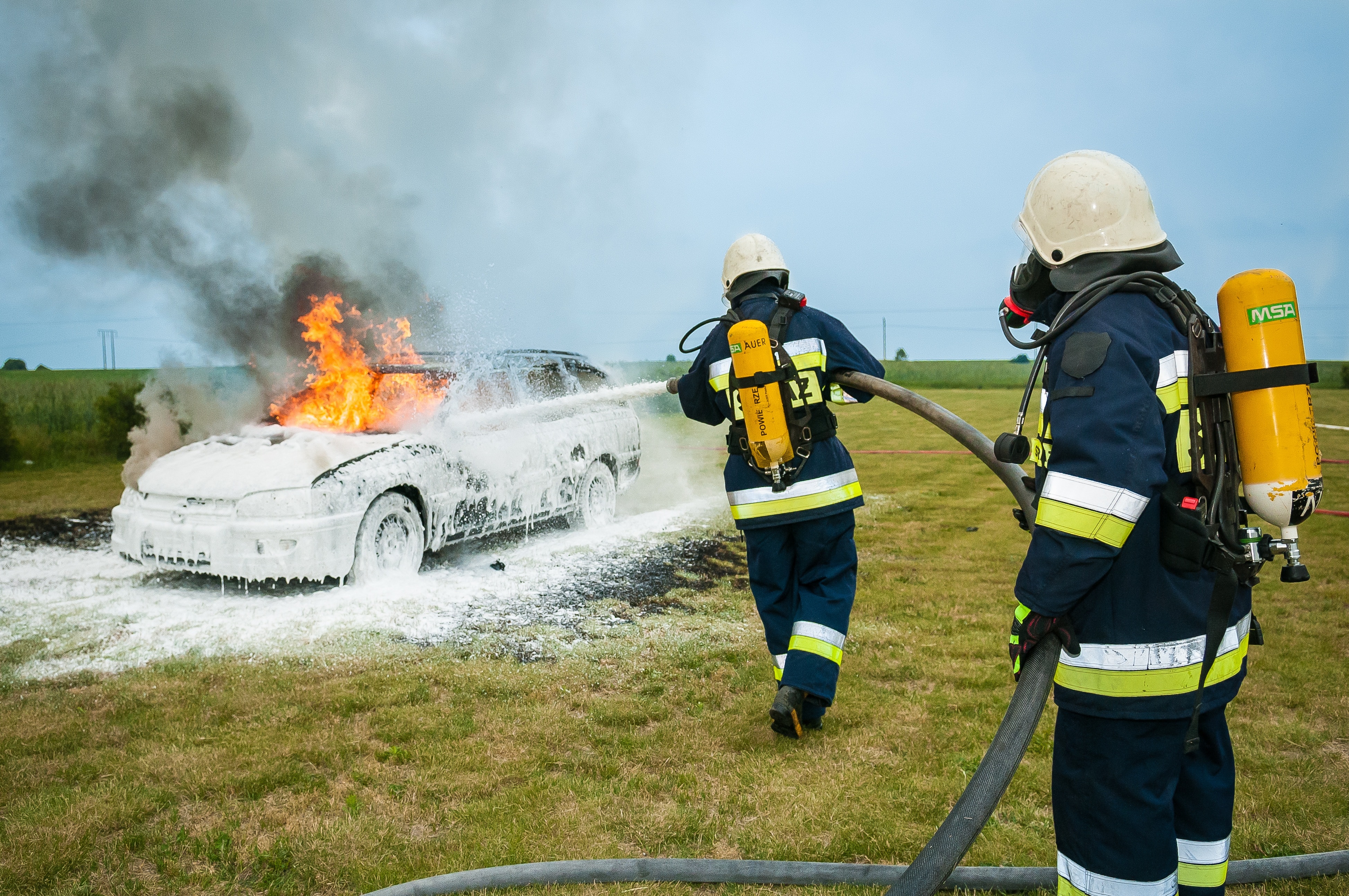 two firemen extinguished the car