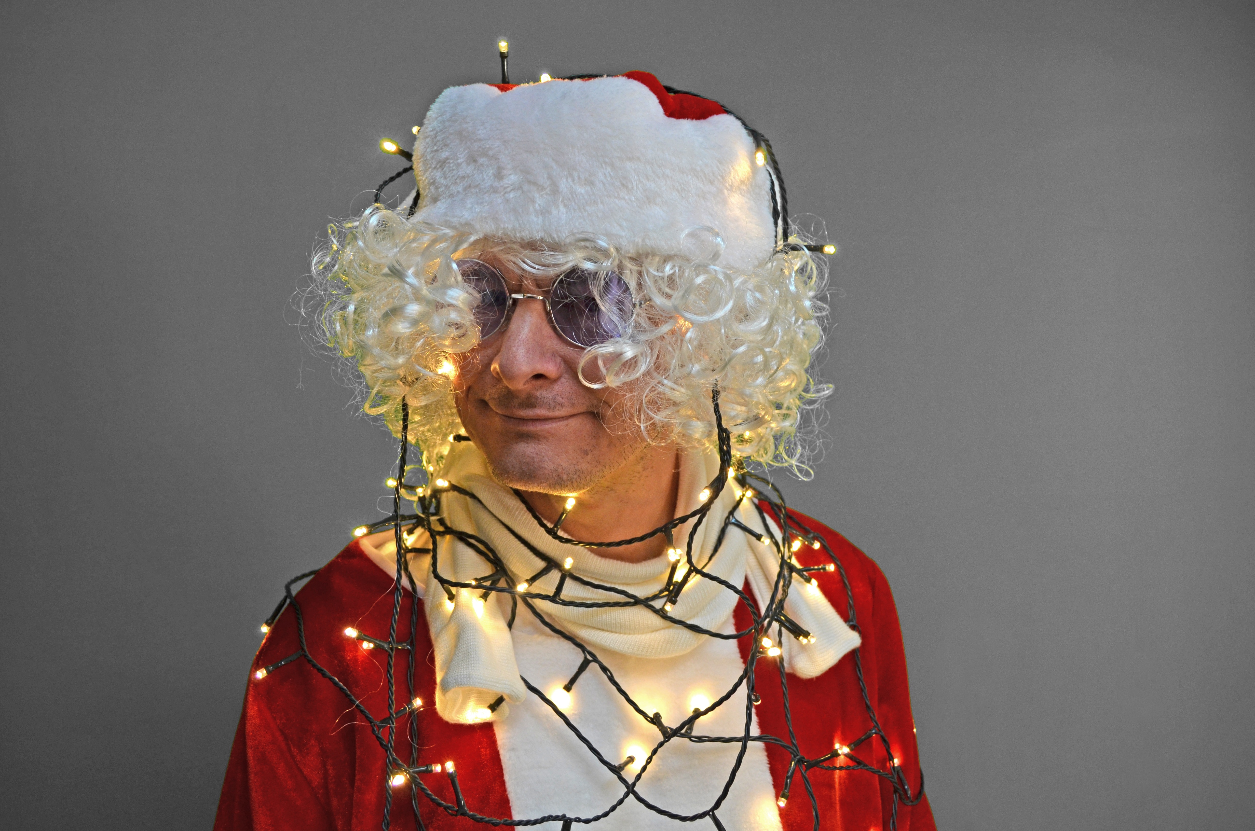 yellow string lights and santa claus costume