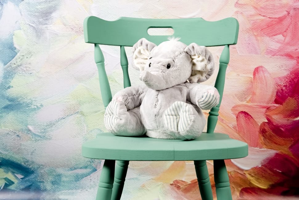 grey elephant plush toy and green windsor chair preview