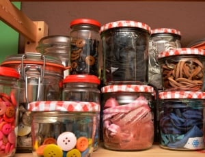 glass jars of clothes buttons and ribbons thumbnail