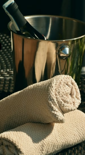brown knitted table napkins with wine bucket thumbnail