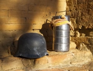 black helmet and stainless steel canister thumbnail