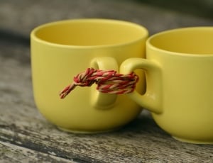 2 yellow ceramic mugs thumbnail