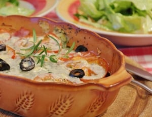 cooked food on brown ceramic casserole thumbnail