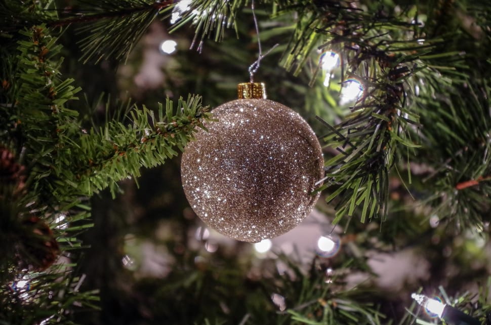 gray christmas ball in pine tree preview
