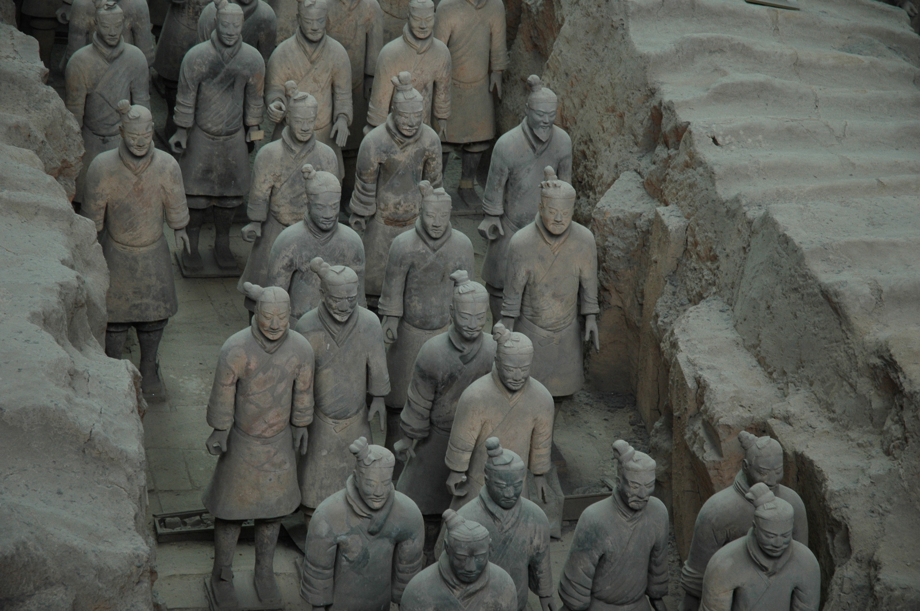 man wearing chinese dress statue lot