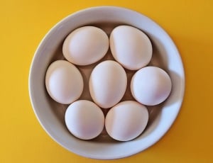 7 eggs on white ceramic bowl thumbnail