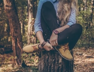 women's black pants and blue denim jacket and brown high tops thumbnail