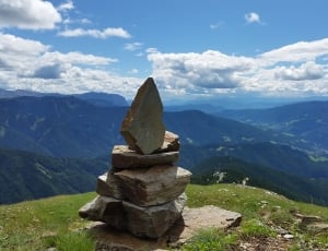brown stacked stones on top of mountain during daytime thumbnail
